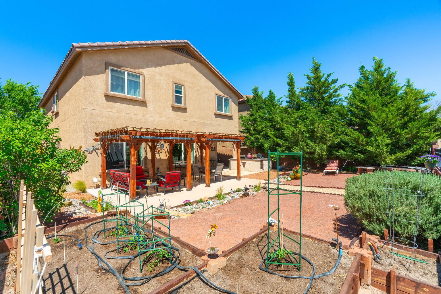 Luxurious primary suite featuring a spacious layout, large windows with natural light, and serene, elegant decor suitable for a private retreat.