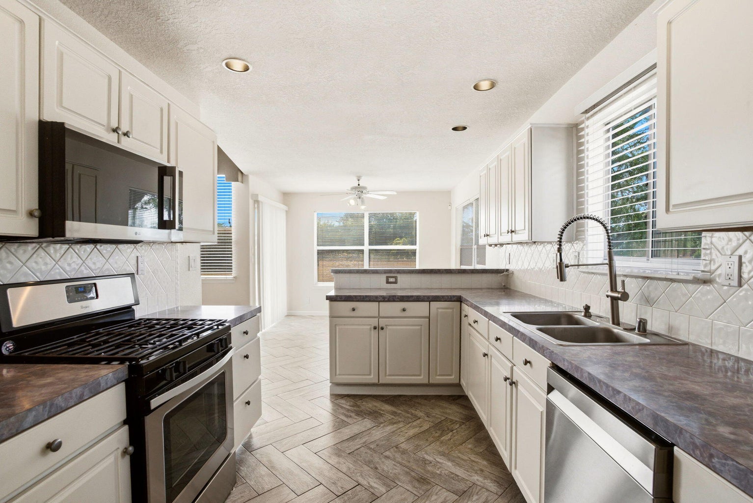 Kitchen at 7415 Coachman Street NE in Albuquerque, showing the spacious kitchen layout designed for gathering and everyday use.