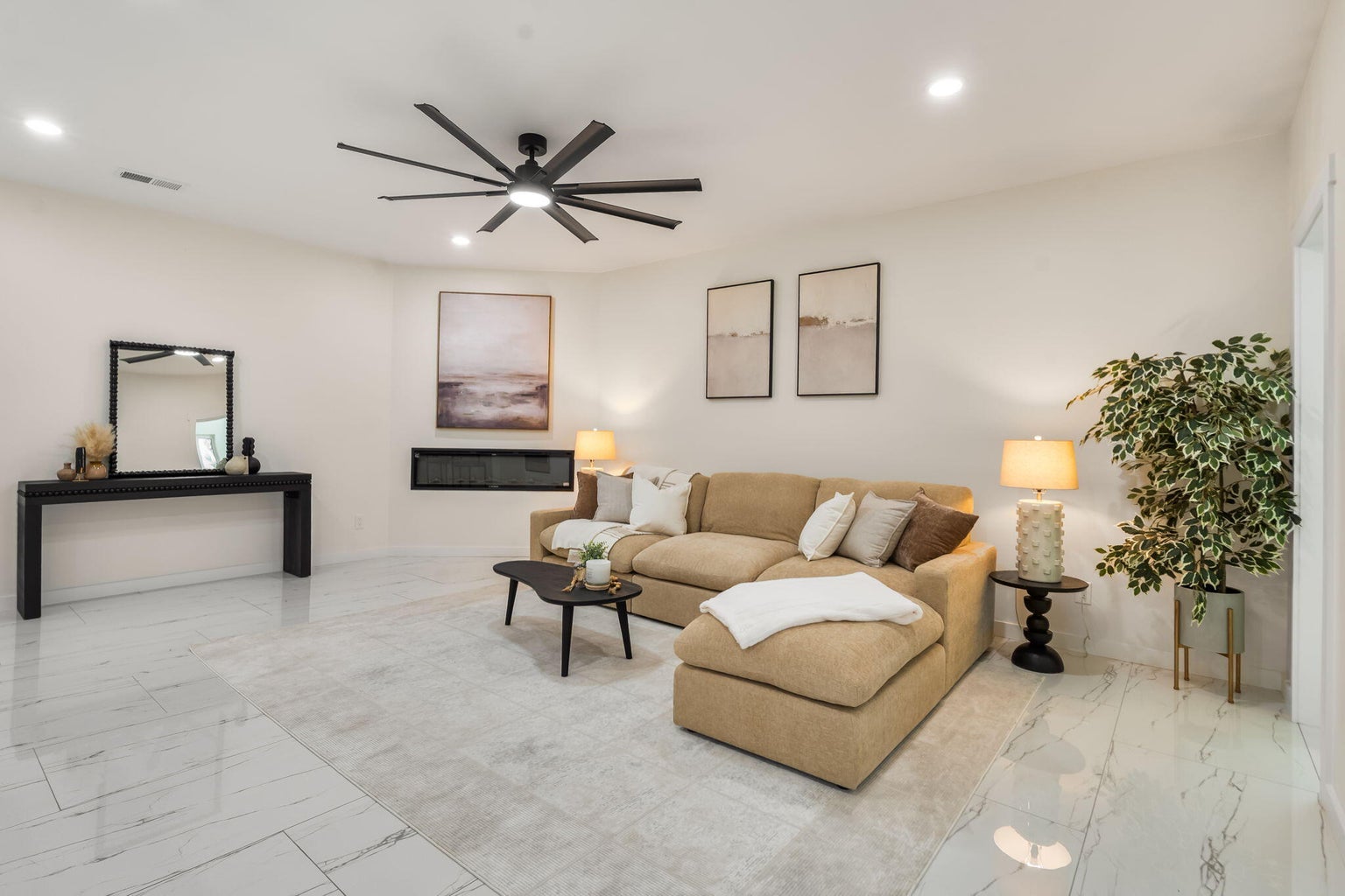 Living room at 1136 Turner Drive NE in Albuquerque, showing a sunlit interior gathering space with contemporary finishes.
