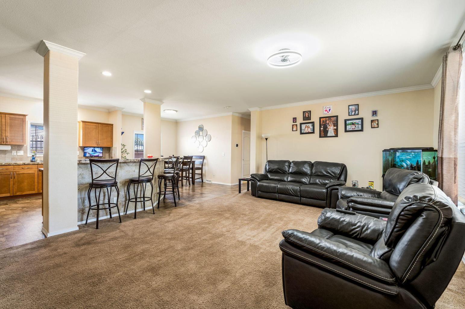 Living room in the main home at 4411 Carlton Street NW in Albuquerque&rsquo;s North Valley two-home property.