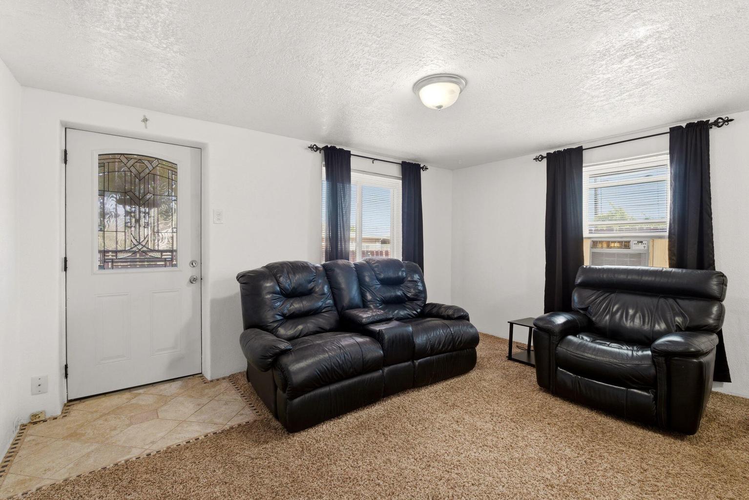 Living room inside the smaller second home at 4411 Carlton Street NW in Albuquerque.