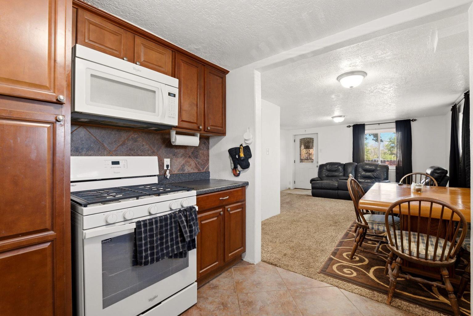 Living room and kitchen area in the smaller second home at 4411 Carlton Street NW in Albuquerque&rsquo;s North Valley.