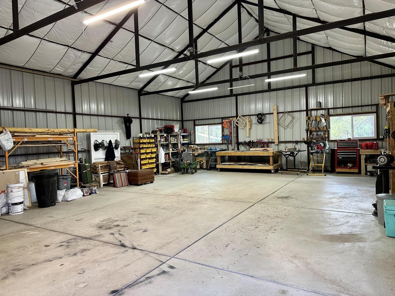 Large 40 by 30 workshop at 459 4th Of July Road with power, work space, storage options, and flexible project potential.