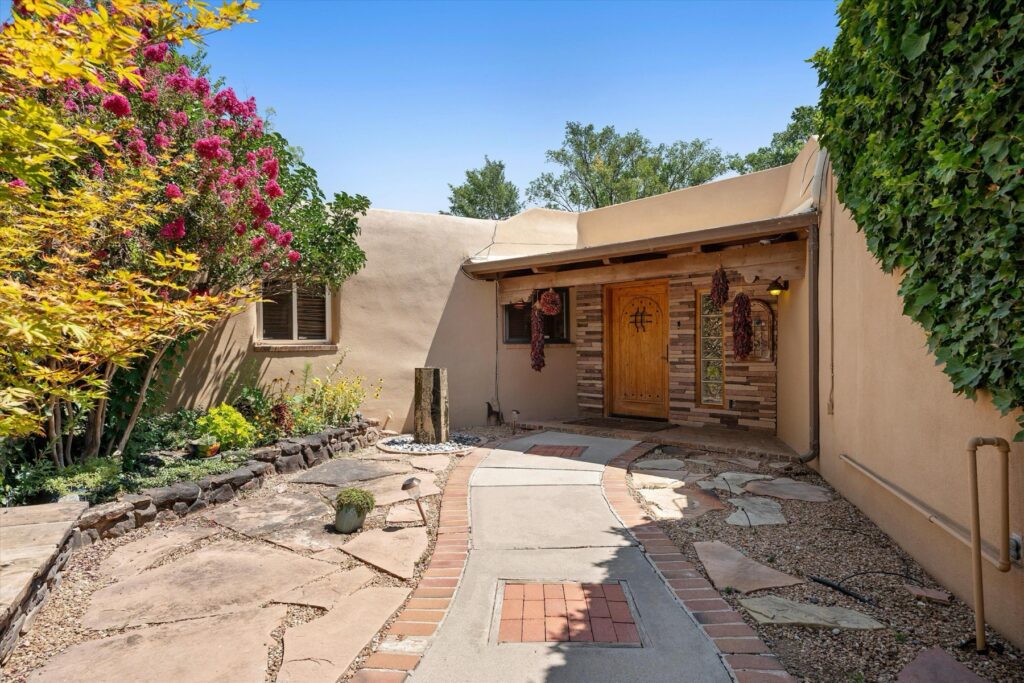 A Los Ranchos Pueblo Home Shaped by Wood, Adobe, and Outdoor Living