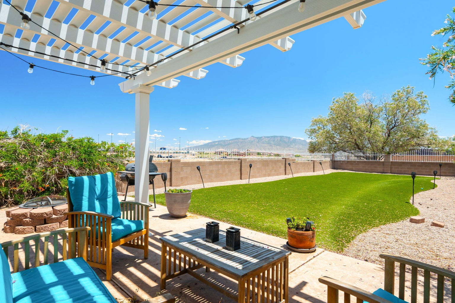 Backyard patio at 2869 Chessman Drive SE in Rio Rancho, NM, showing outdoor living space with Sandia Mountain views.