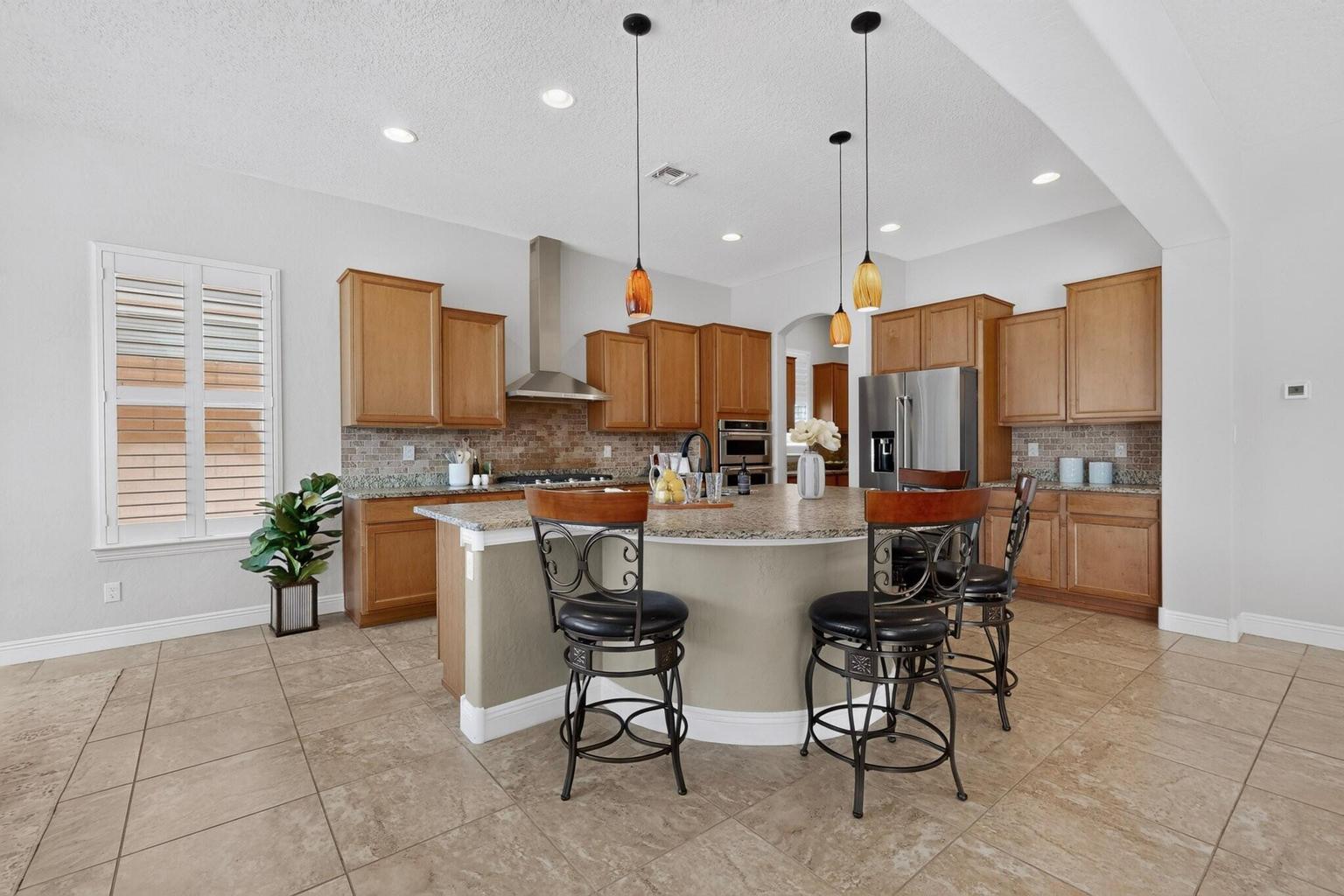 Breakfast nook at 4707 Lluvia Encantada in Santa Fe, showing a dining area connected to the home&rsquo;s everyday living spaces.