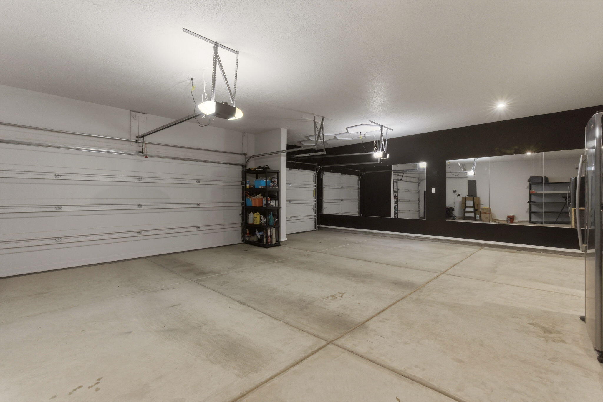 Finished three-car garage at 3206 Martuni Street SE in Rio Rancho, showing attached garage space for vehicles, storage, and household organization.