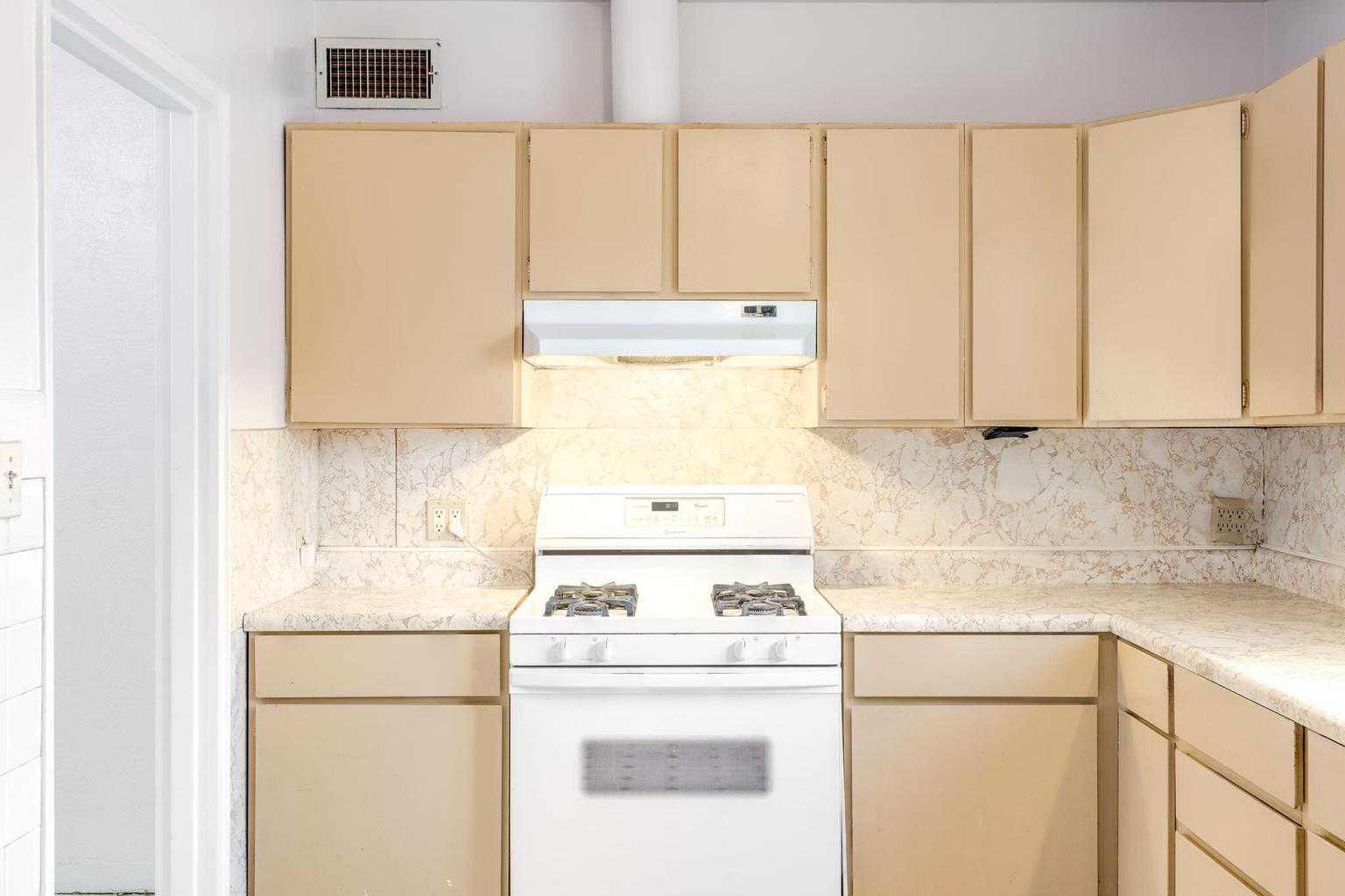 Kitchen at 2721 Bel Air Drive NE in Albuquerque, showing windows that bring natural light into the workspace.