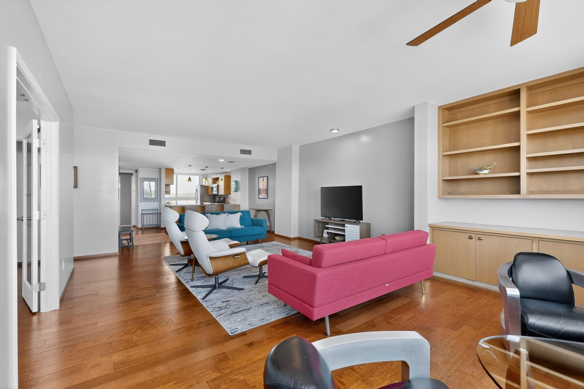 Living area at 600 Alcalde Place SW 5A in Albuquerque, showing wood flooring and an open interior gathering space.