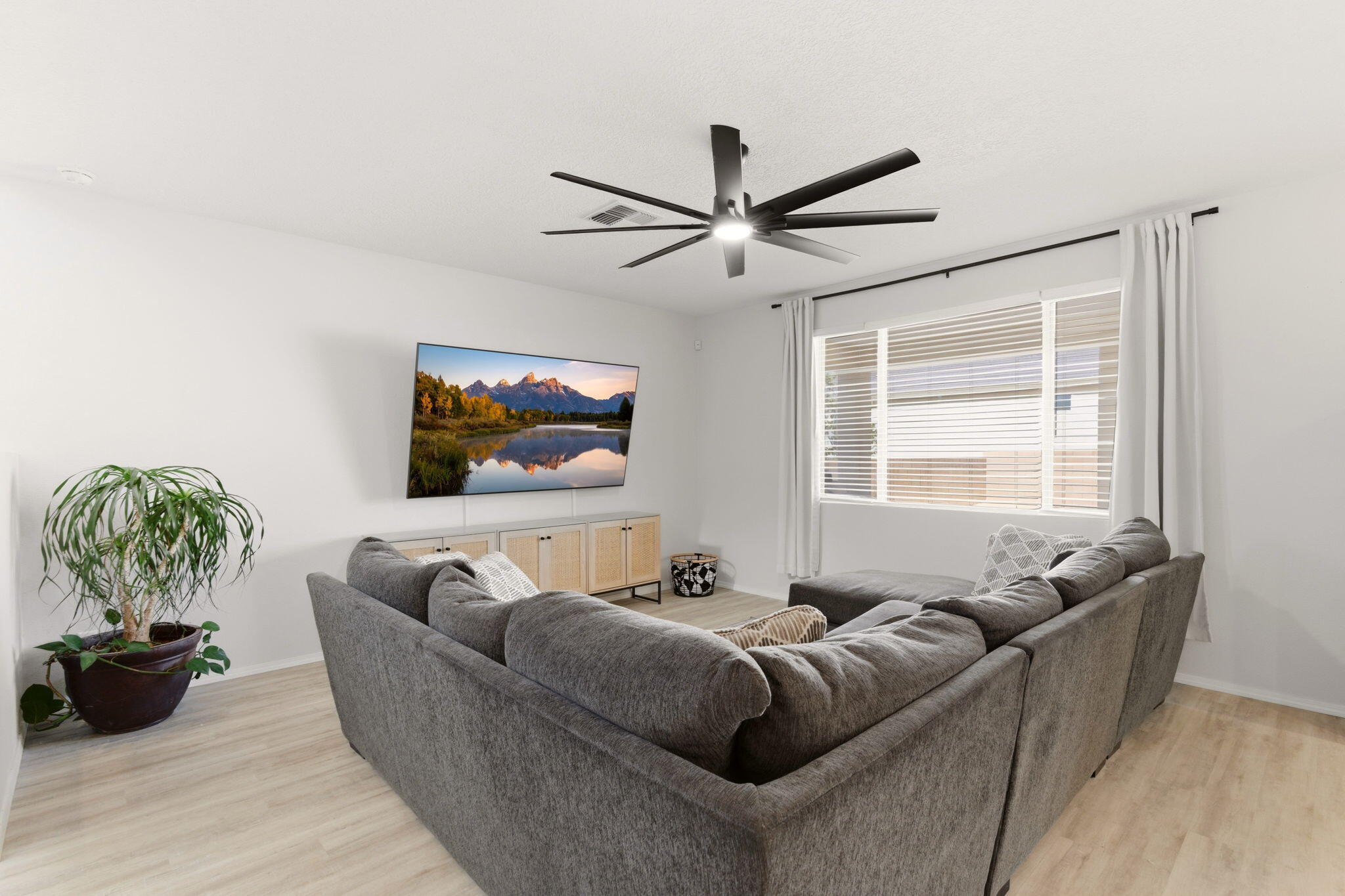 Living room at 3206 Martuni Street SE in Rio Rancho, showing the open great room layout with high ceilings and connected everyday living space.