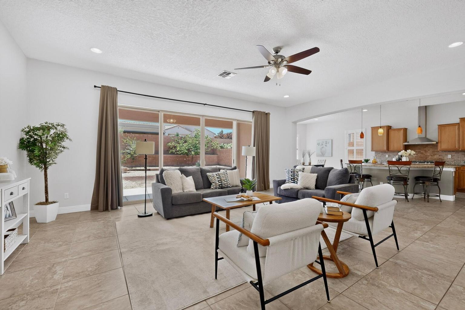 Living room at 4707 Lluvia Encantada in Santa Fe, showing the great room gathering area and interior seating space.