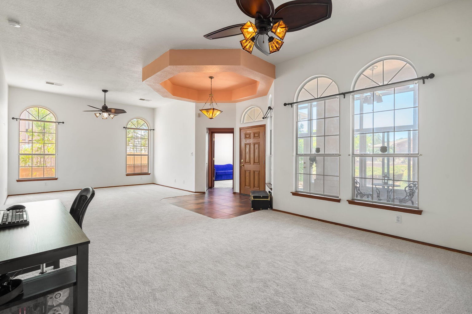 Open living room at 2869 Chessman Drive SE in Rio Rancho, NM, showing natural light and connected interior gathering space.