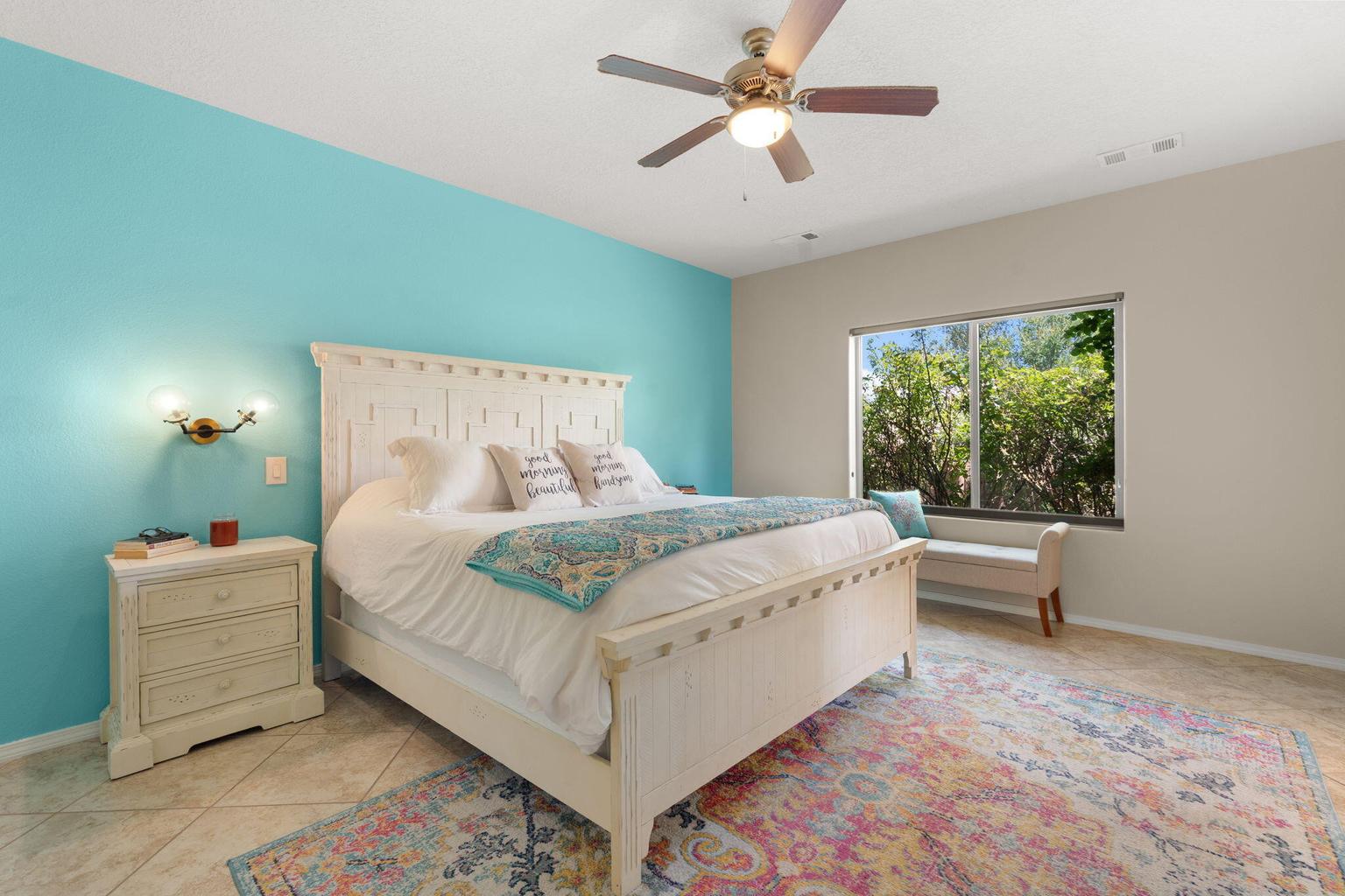Primary suite at 12115 Aqueduct Road SE in Albuquerque, showing the bedroom space and natural light.