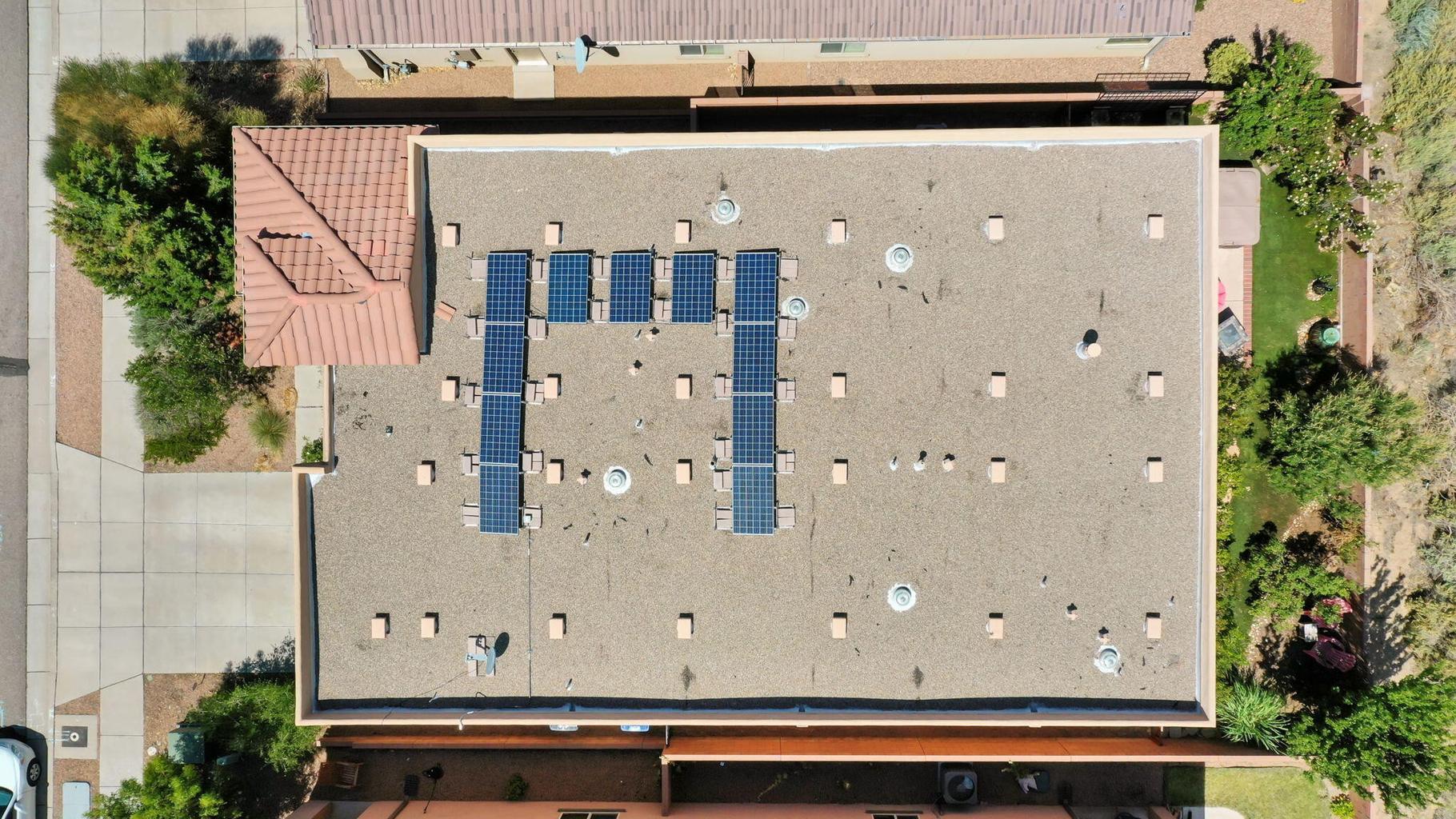 Solar panels at 12115 Aqueduct Road SE in Albuquerque, showing the property&rsquo;s solar feature for buyer verification.