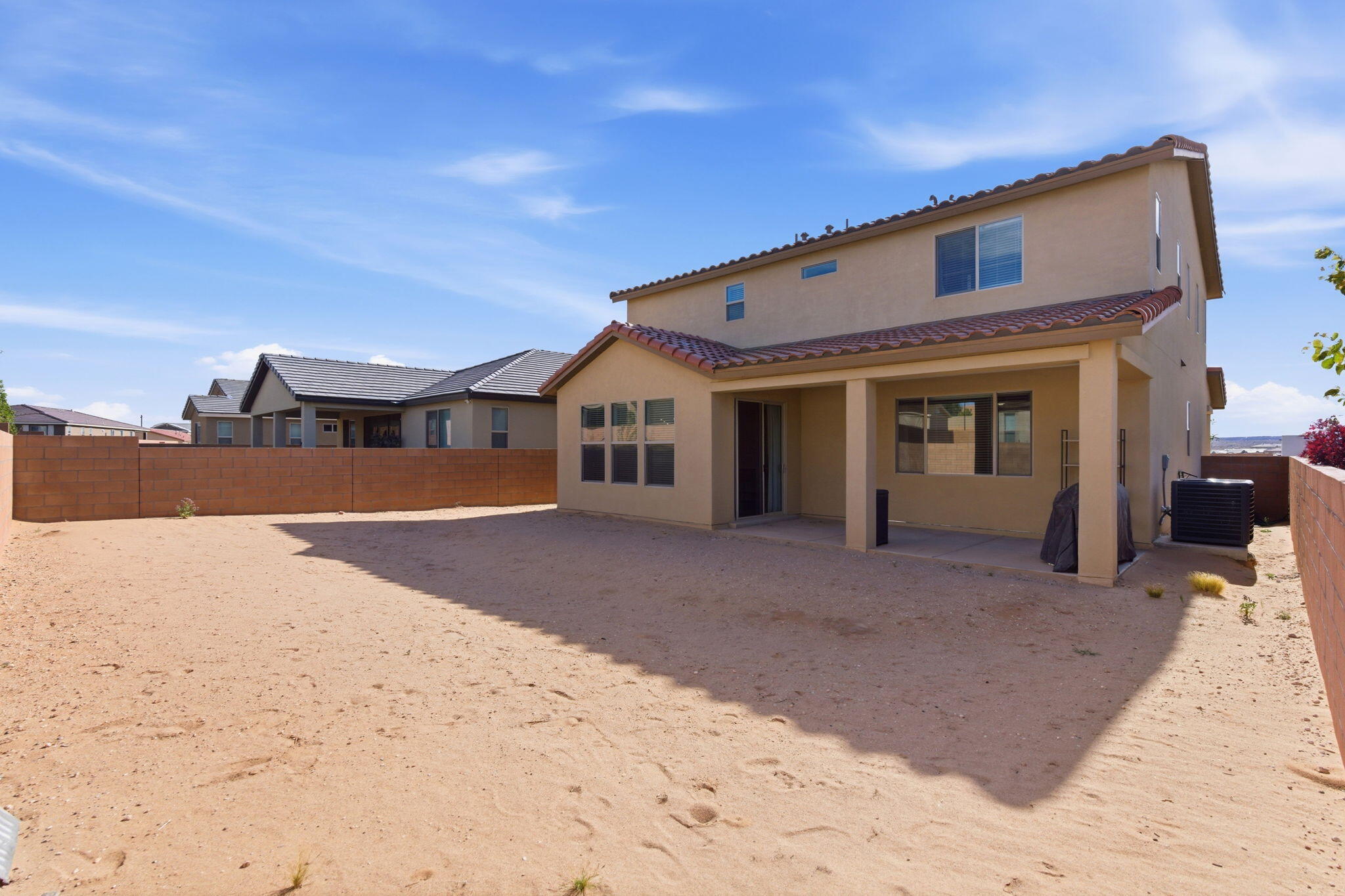 Backyard at 3206 Martuni Street SE in Rio Rancho, showing the fenced outdoor area and blank-slate yard space for future personalization.