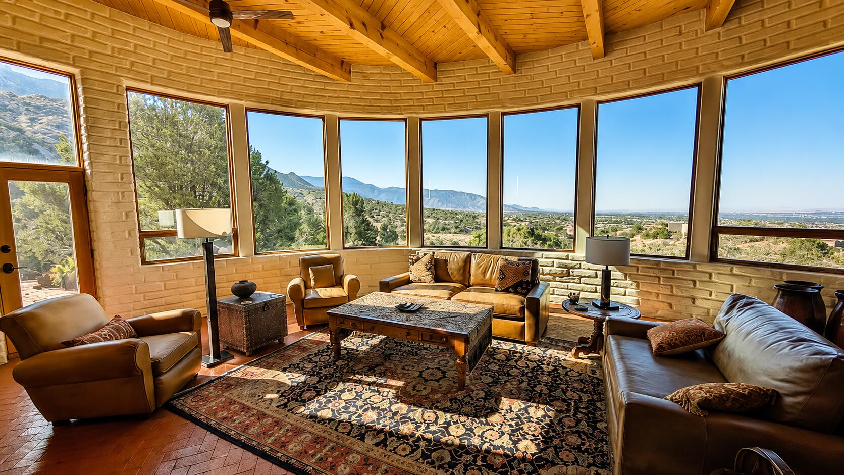 Living room at 303 Spring Creek Place NE with expansive Sandia foothills and city views