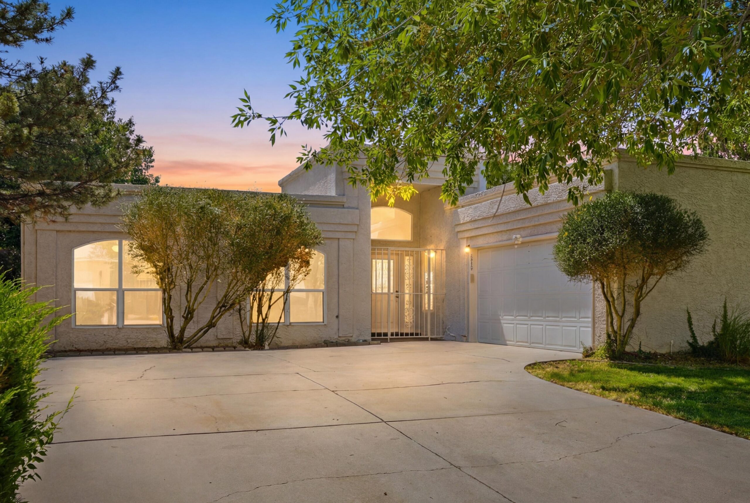 Twilight front exterior of 7415 Coachman Street NE