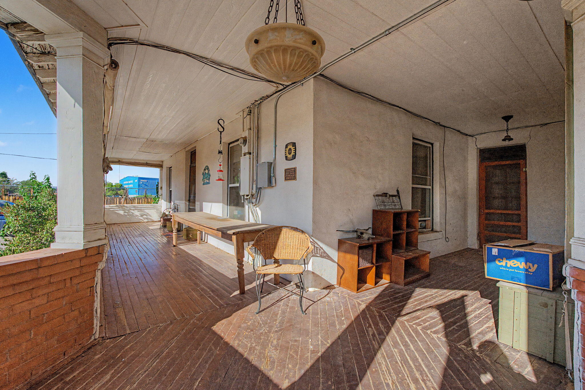 Wood-floored wraparound covered porch at 9742 4th Street NW