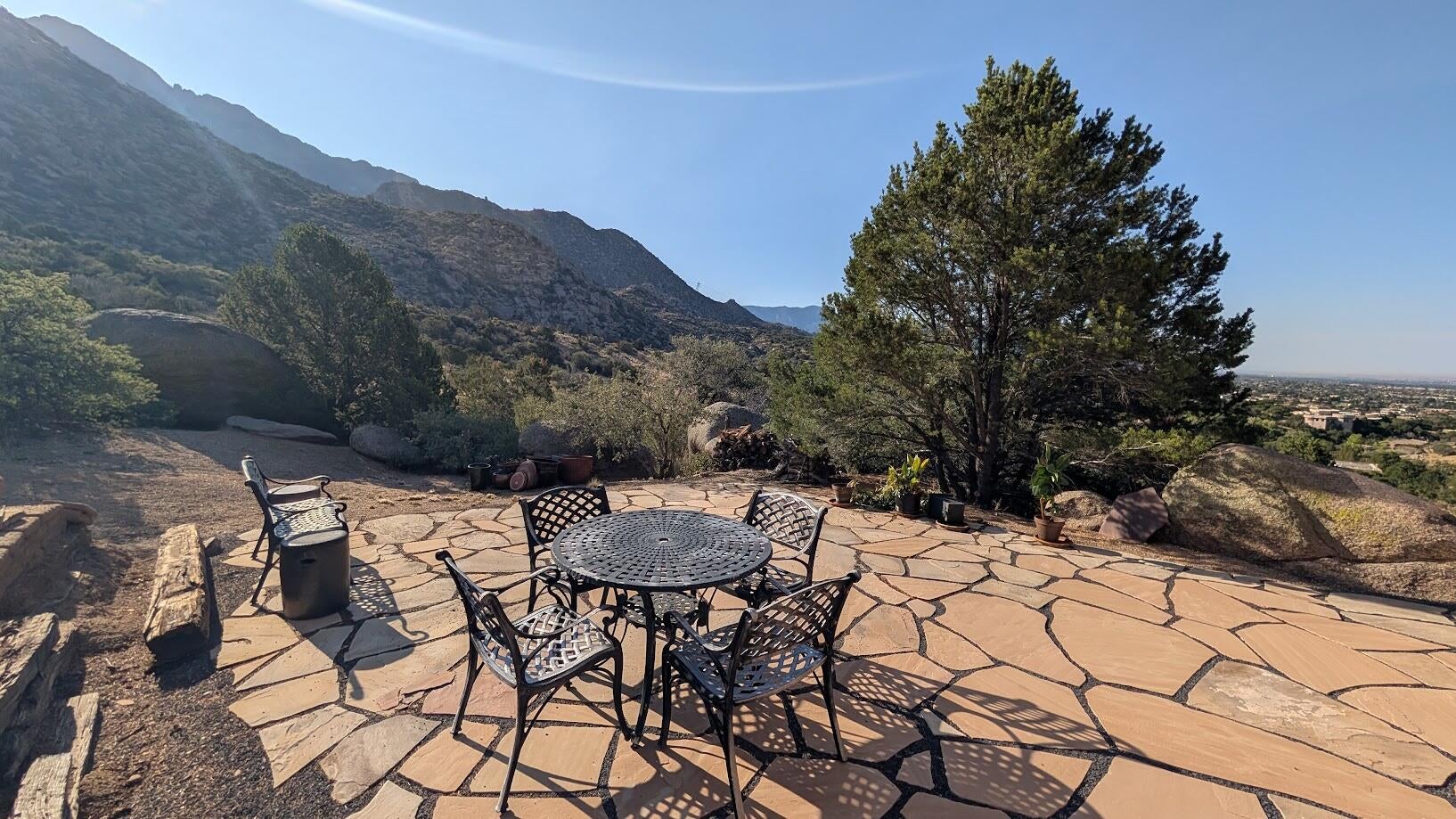Aerial context of 303 Spring Creek Place NE at the edge of the Sandia foothills