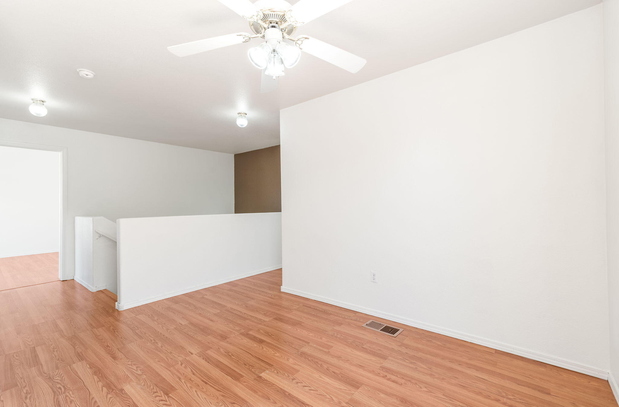 Open upstairs loft beside the stair landing.