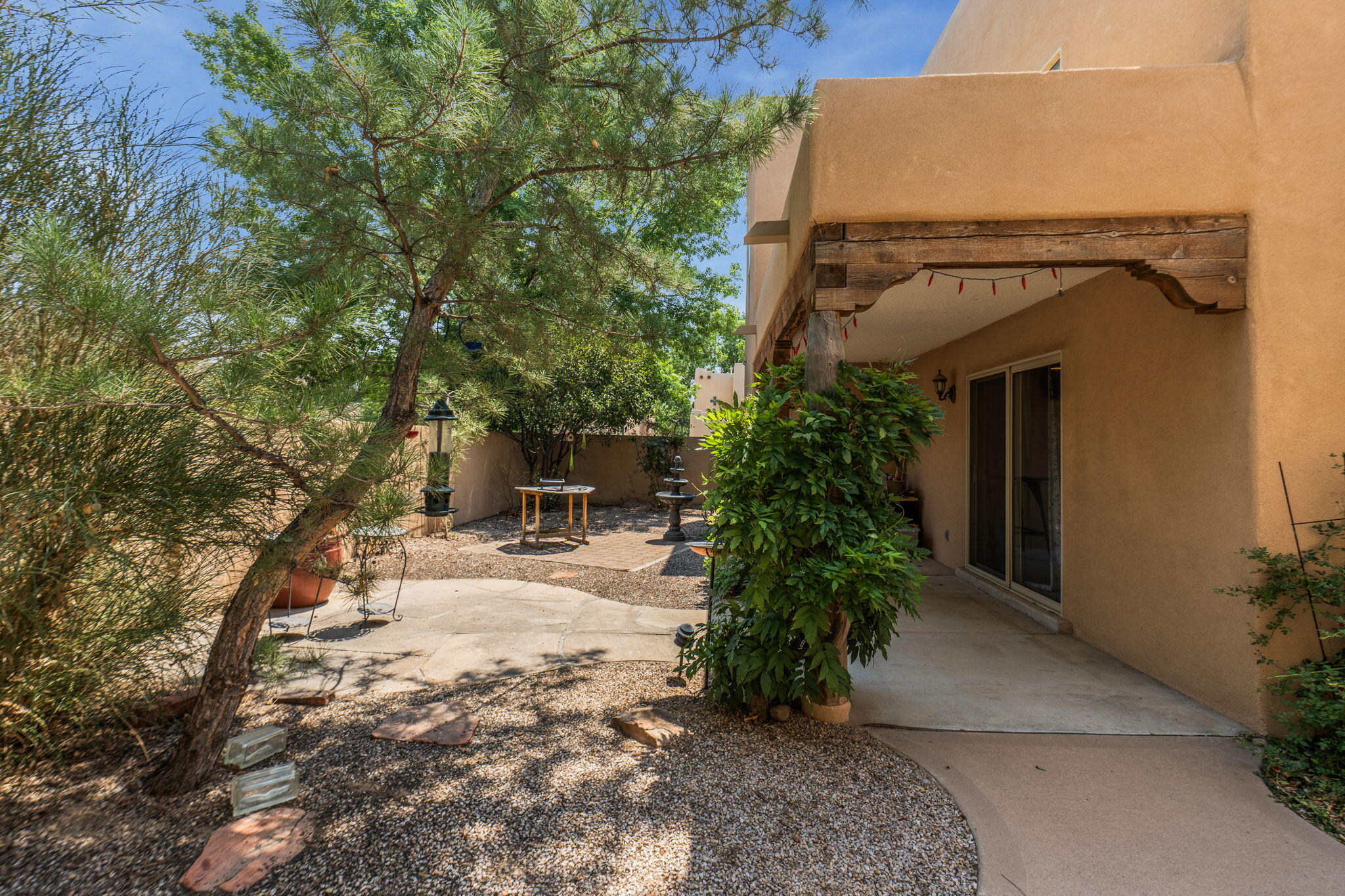 Tree-lined neighborhood path near the Rio Grande Bosque access by 3601 Calle Oveja Court NW