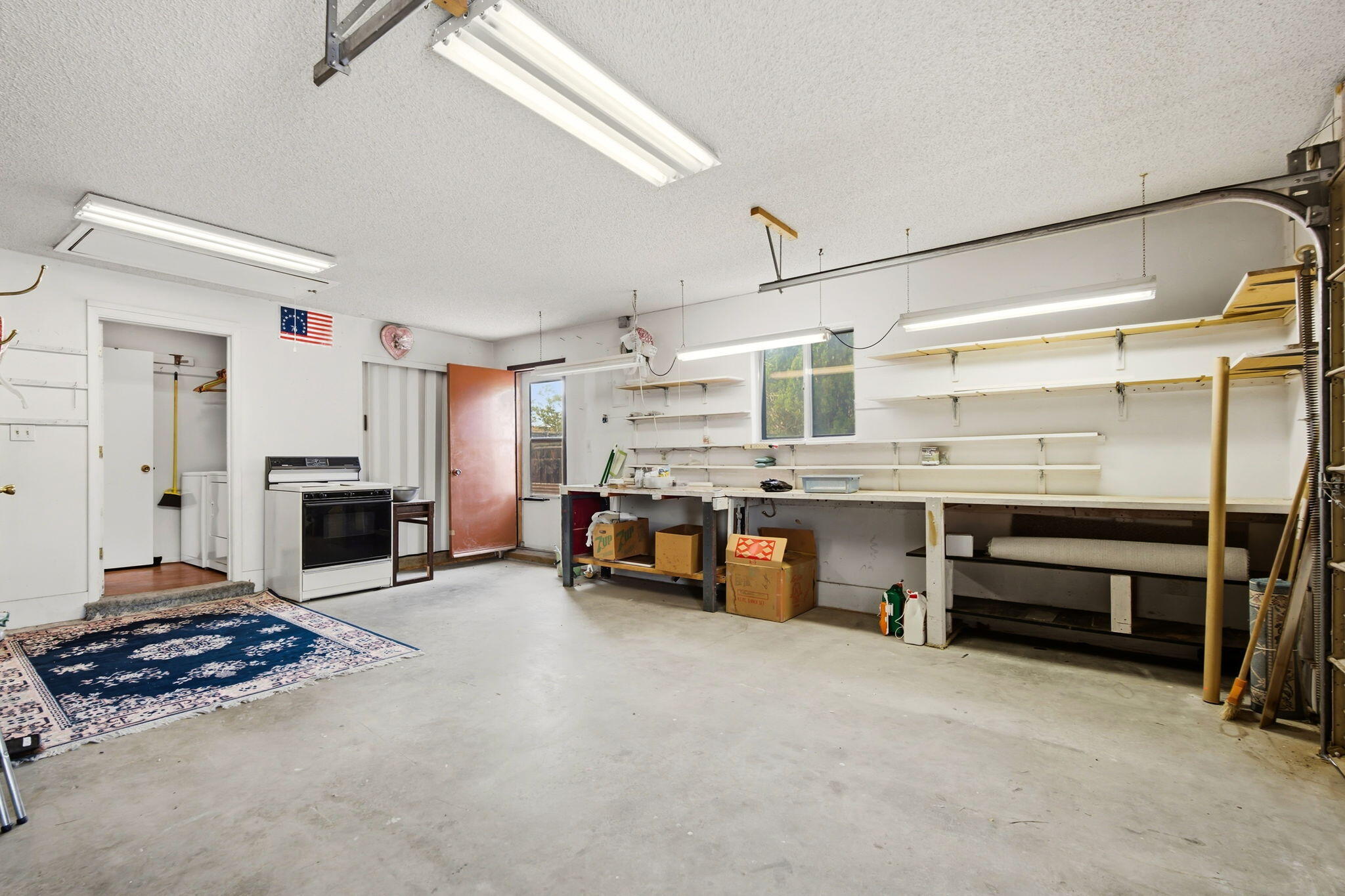 Attached one-car garage with a small workshop area at 4108 Leon Grande Avenue SE