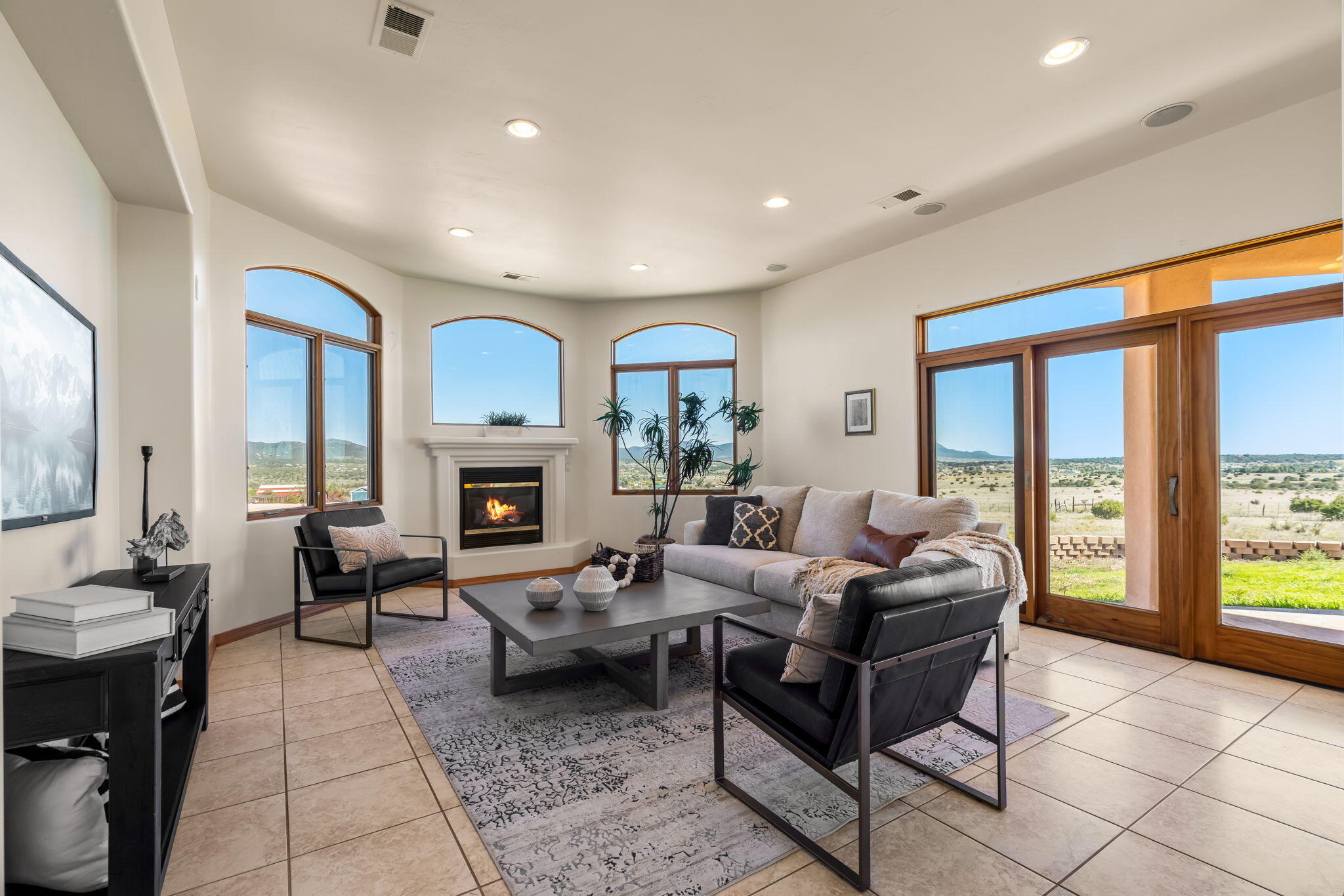 Bright living room with gas fireplace and deck access at 31 Kramer Road